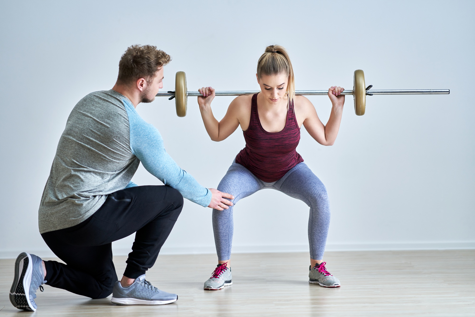 Woman with her personal fitness trainer